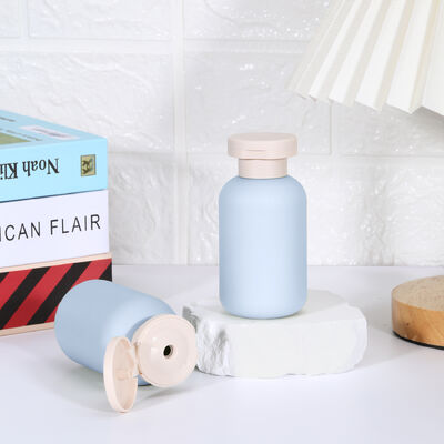 Buy Luxury Green Blue Pink 100~500ml Minisize Cosmetic Skincare Shampoo Conditioner Body Lotion Squeeze Travel Bottle with Flip Top Cap online manufacture